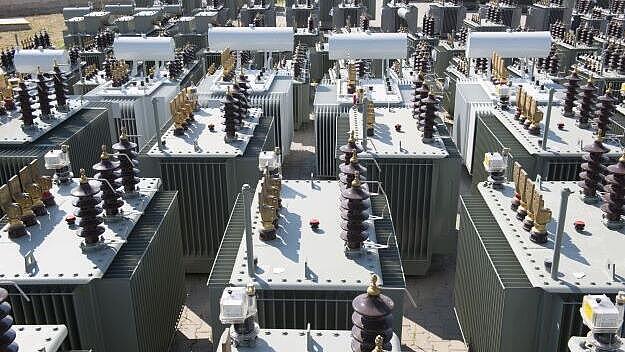 Integrating energy and material efficiency in public distribution transformers
